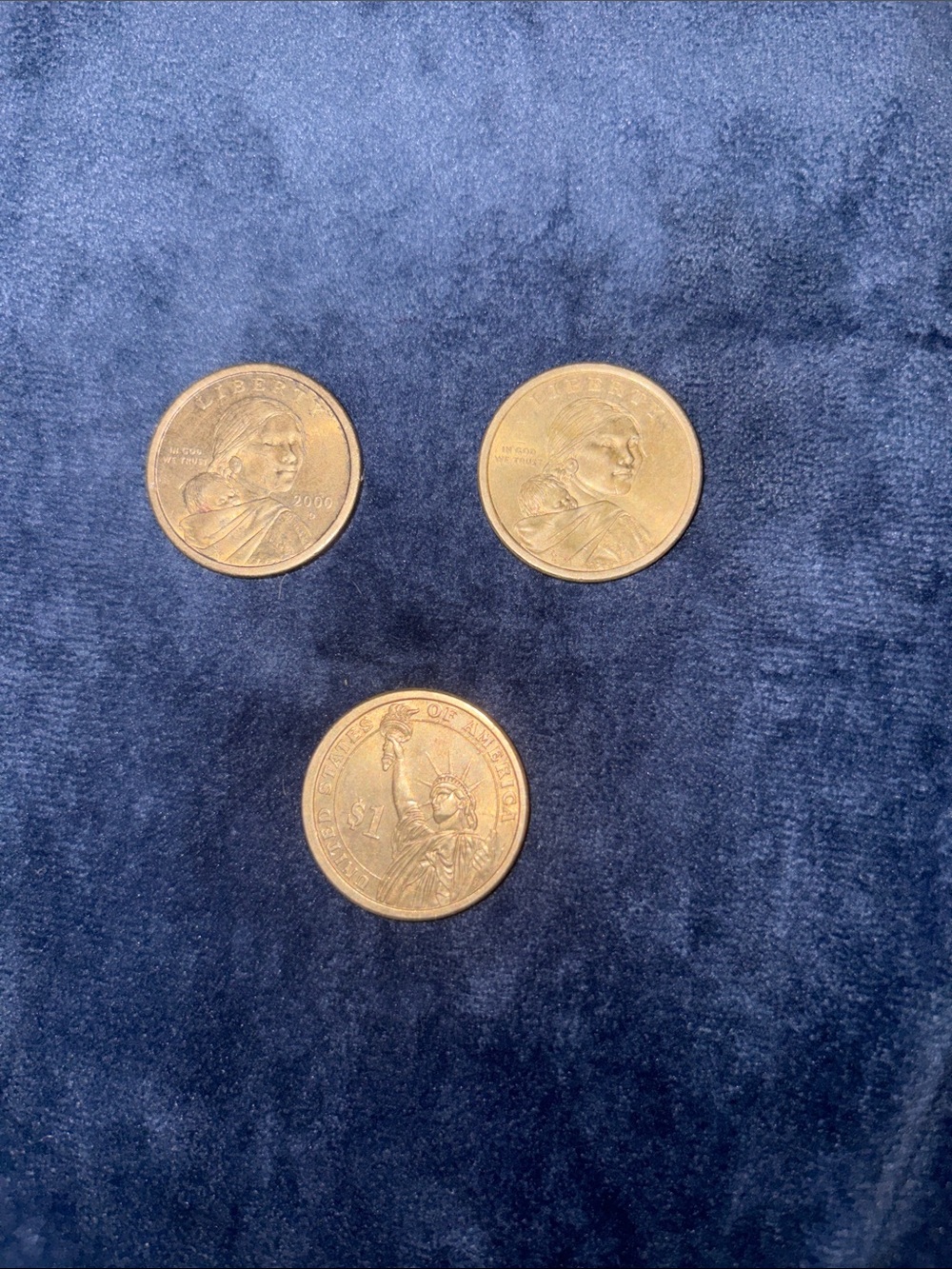 Two Sacagawea and one original one dollar coin